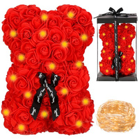 Ours en rose avec guirlande lumineuse LED dans une boîte cadeau